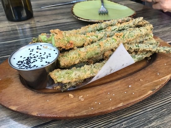 Fork signature dishes Asparagus Fries, Urban Burger, Cast Iron Skillet Fried Chicken, seasonal salads and entrees reflecting local availability.